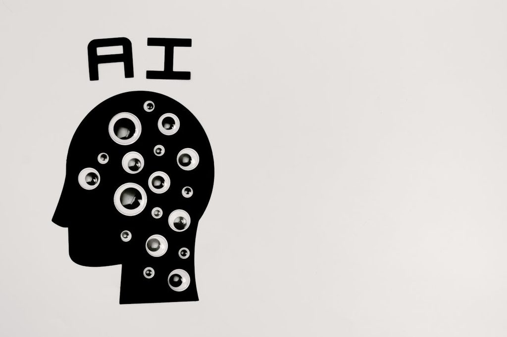 a black and white image of a head with many eyes representing social media marketing